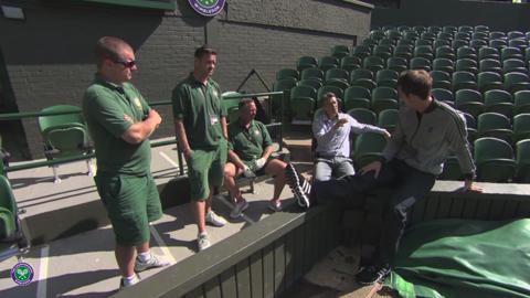 Champion Andy Murray chats with the Wimbledon groundstaff
