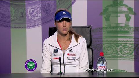 2013 Girls' champion Belinda Bencic talks to the media