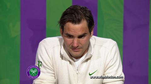 Wimbledon champion Roger Federer talks to the media