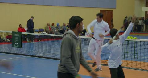 Tennis in a school sports hall
