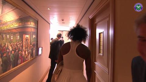 Serena shows off her new trophy to the fans